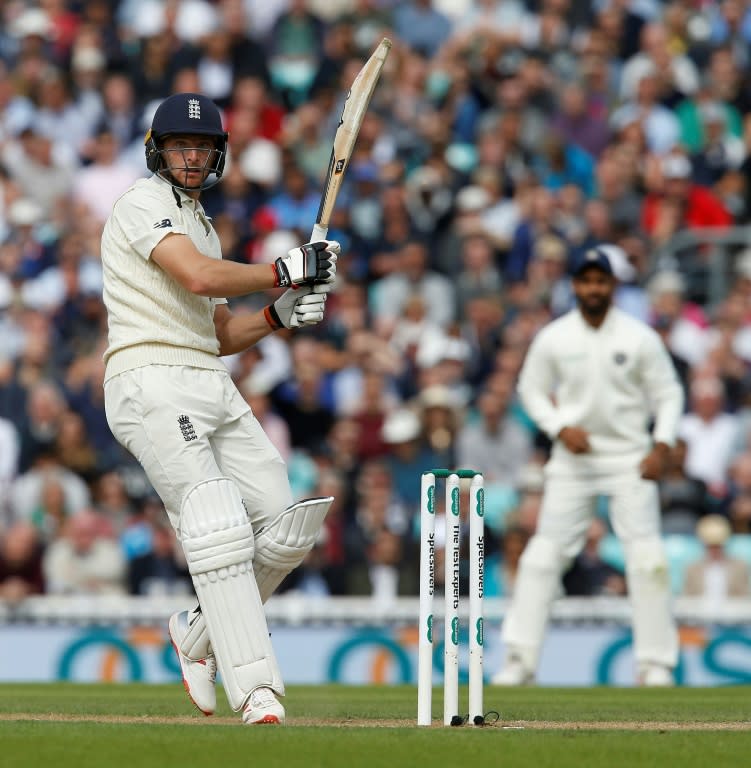 Jos Buttler smashes a six during England's first innings in the fifth Test against India