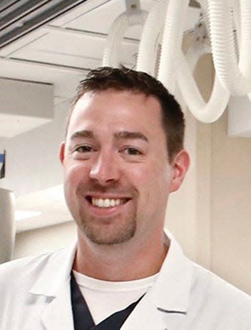 ER physician Ryan Squier, who started the Ohio ACEP Opiate Awareness Team aimed at ending opiate abuse through education, poses for a portrait on Wednesday, July 11, 2018, in the Grant Hospital emergency department. [Fred Squillante/Dispatch]