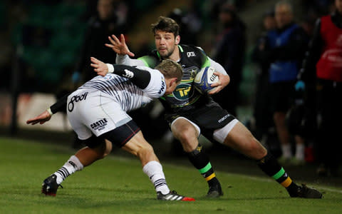 Ben Foden looks to sidestep Hanno Dirksen - Credit: ACTION IMAGES