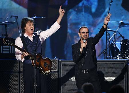 Paul McCartney (L) and Ringo Starr perform during the taping of "The Night That Changed America: A GRAMMY Salute To The Beatles", which commemorates the 50th anniversary of The Beatles appearance on the Ed Sullivan Show, in Los Angeles January 27, 2014. REUTERS/Mario Anzuoni