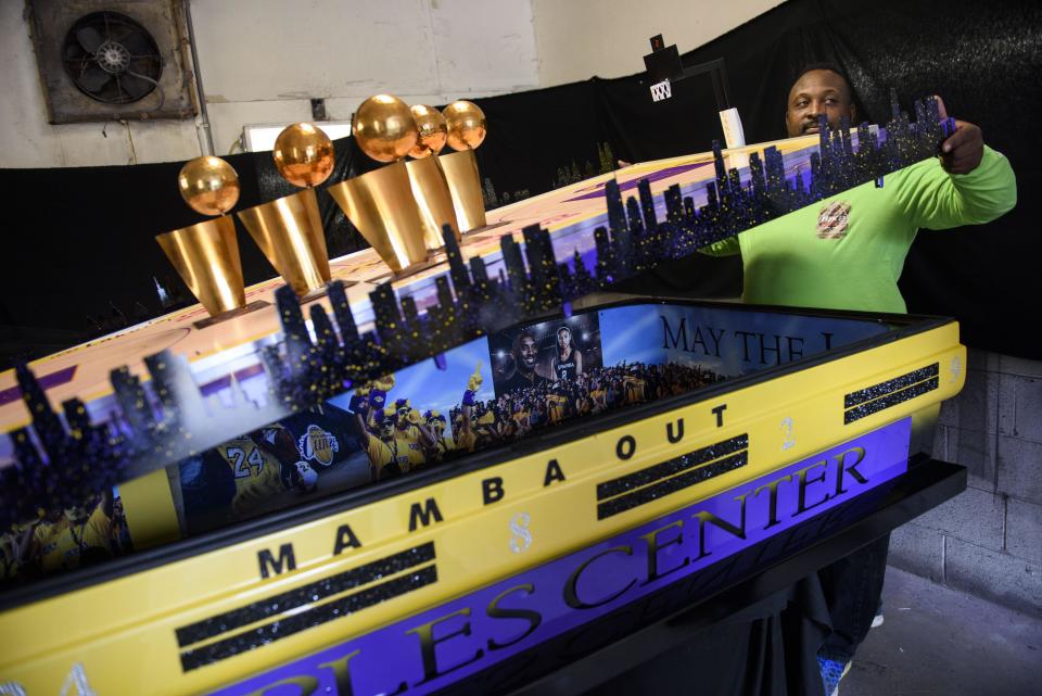 Fletcher Collins, owner of Glorious Custom Designs, shows off a memorial casket he built in honor of Kobe Bryant on Feb. 12.