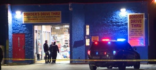 Akron police investigate an apparent fatal shooting at Border's Drive Thru on South Arlington Street early Wednesday morning.