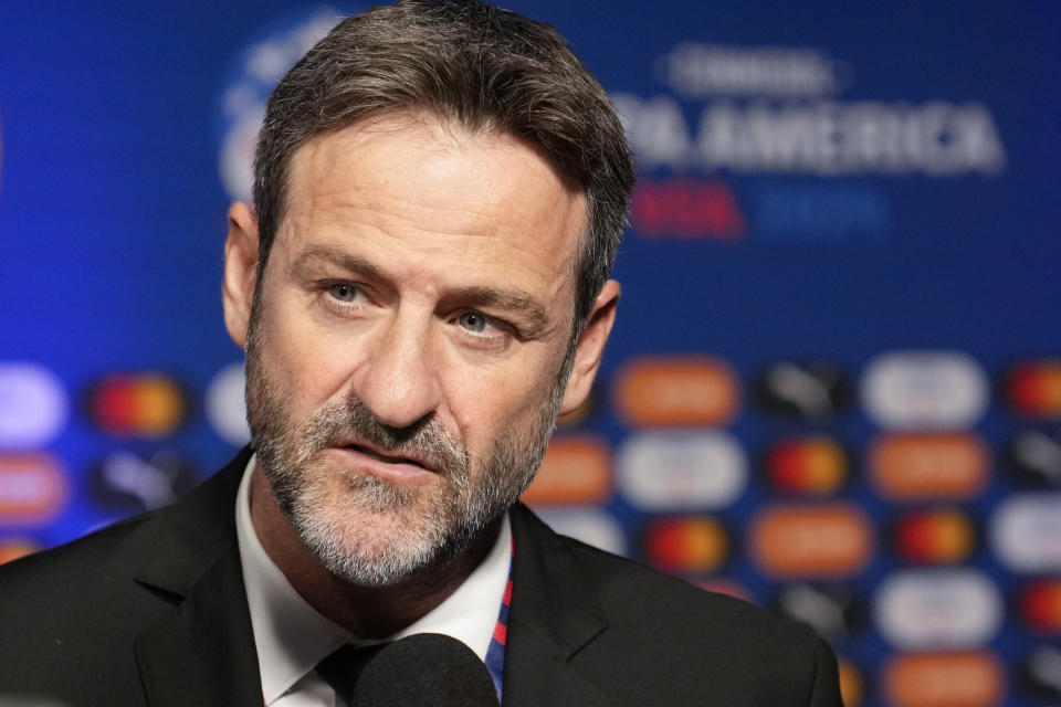 Panama's coach Thomas Christiansen talks to journalists as he arrives to the draw ceremony for the Copa America soccer tournament, Thursday, Dec. 7, 2023, in Miami. The 16-nation tournament will be played in 14 U.S. cities starting with Argentina's opener in Atlanta on June 20, 2024. (AP Photo/Lynne Sladky)