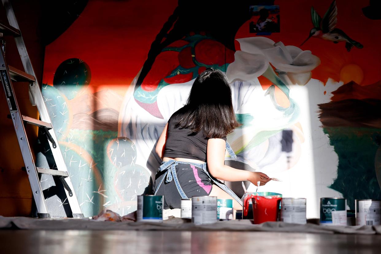 Adamaris Rodriguez paints her piece "Para Adelante" on March 4 for the Fresh Paint mural project in Oklahoma City.