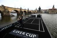 <p>Roger Federer of Switzerland in action against Tomas Berdych of The Czech Republic in front of the Charles Bridge during the countdown to the inaugural Laver Cup in Prague, Czech Republic. </p>