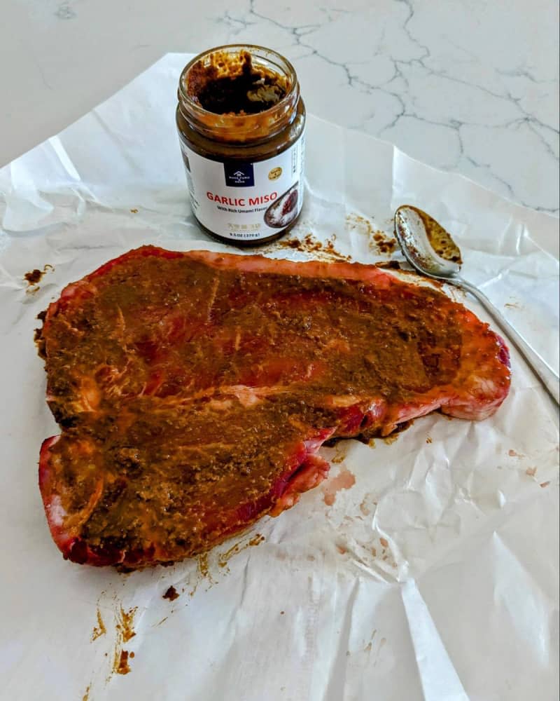 Steak covered in garlic miso sauce