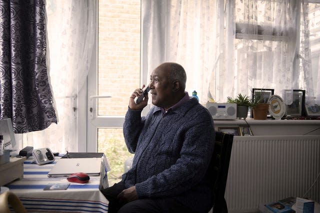 Michael, 71, chatting to a volunteer called Gemma from Age UK 