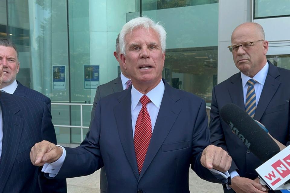 Influential Democratic power broker George Norcross, center, speaks outside the justice complex in Trenton, NJ Monday, June 17, 2024, (AP)