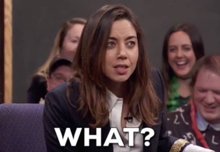 Aubrey Plaza with a surprised expression and the word "WHAT?" in bold text superimposed