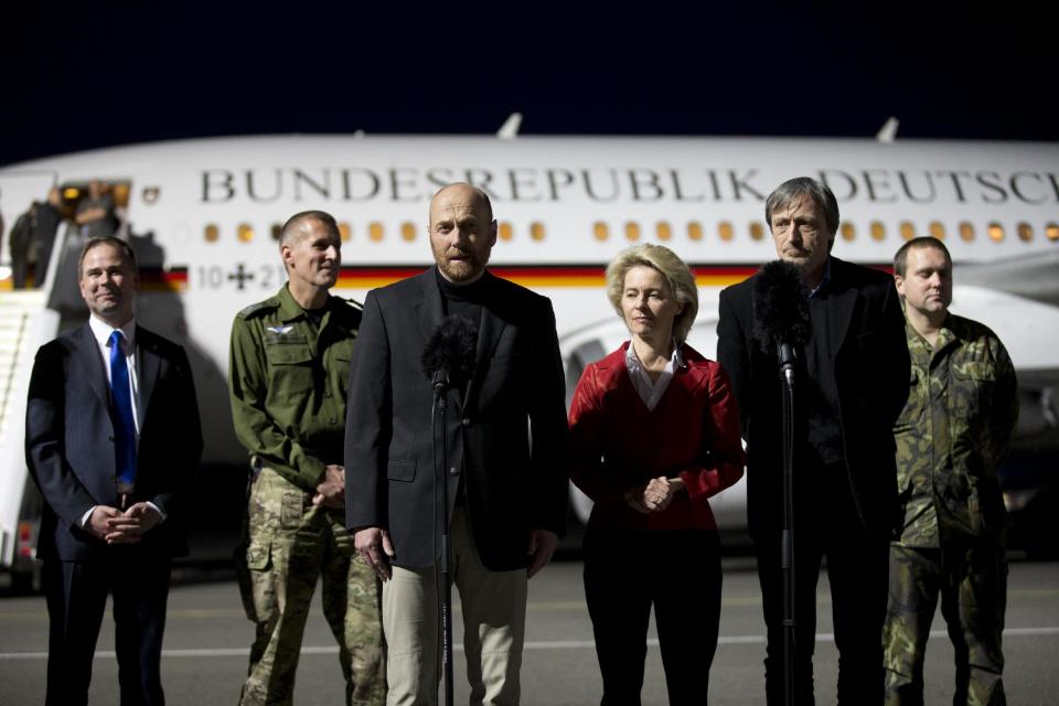 Denmark's minister for defense Nicolai Waamen, left), Czech Defence Minister Martin Stropnicky, 2nd right, and German Defense Minister Ursula von der Leyen, 3rd right, and two other military observers listen as German head of foreign military observers, Col. Axel Schneider, 3rd left, talks to the media in Berlin, Germany, Saturday, May 3, 2014, after being released in Slovyansk, eastern Ukraine. The group of military observers were held in captivity accused of being NATO spies by a pro-Russian insurgency group. The German-led, eight-member team was traveling under the auspices of the OSCE when they were detained. (AP Photo/Axel Schmidt)
