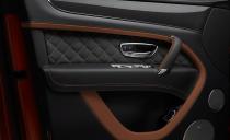 <p>Bentley swaps out leather in certain areas, such as the steering-wheel rim, for faux suede and carbon fiber instead of book-matched wood.</p>