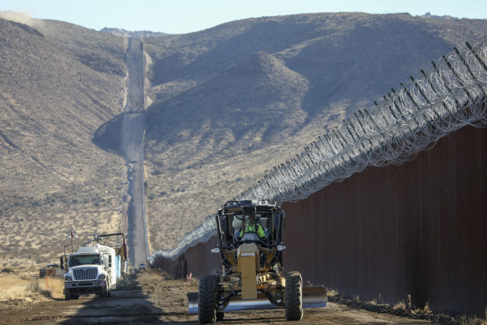 JACUMBA, CA - DECEMBER 01: Construction crews work on the United States-Mexico border wall on December 1, 2020 in Jacumba, California. President-elect Joe Biden wants to stop construction of the border wall, but the departing Trump administration is rushing to complete as much wall as possible in its last weeks in power. (Photo by Sandy Huffaker/Getty Images)