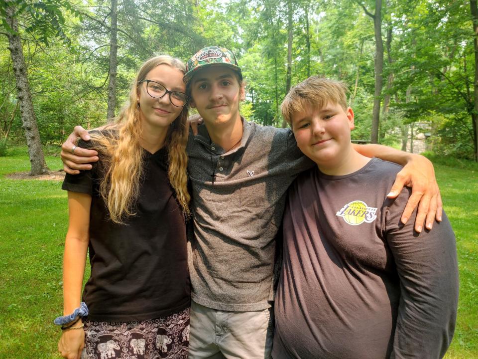 Micah Kelly, right, is Giovanni's younger brother. He is pictured with Giovanni's best friend Landon Jordan and Jordan's girlfriend, Marley Green.