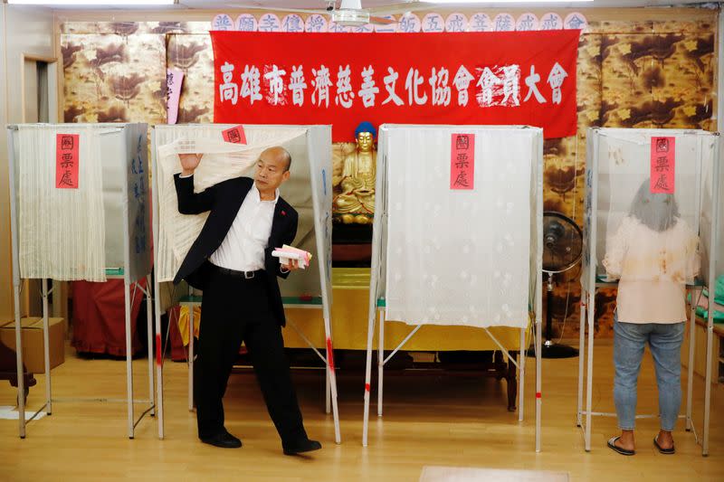 Taiwan's opposition Kuomintang Party (KMT) presidential candidate Han Kuo-yu votes at a polling station during general elections in Kaohsiung