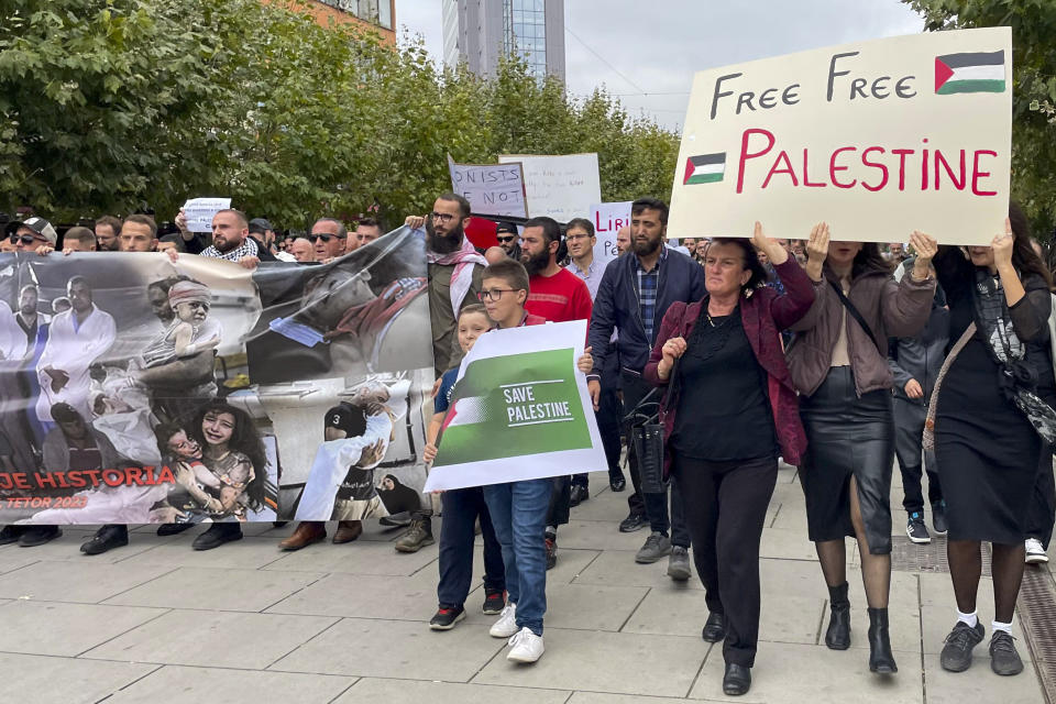 Pro-Palestinian supporters march through downtown Pristina, Kosovo, Saturday, Oct. 21, 2023. (AP Photo/Zenel Zhinipotoku)