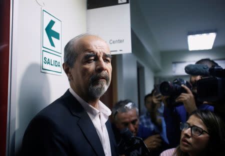 Peruvian lawmaker Mauricio Mulder stands in a hallway of the hospital where Peru's former President Alan Garcia was taken after he shot himself, in Lima, Peru April 17, 2019. REUTERS/Janine Costa