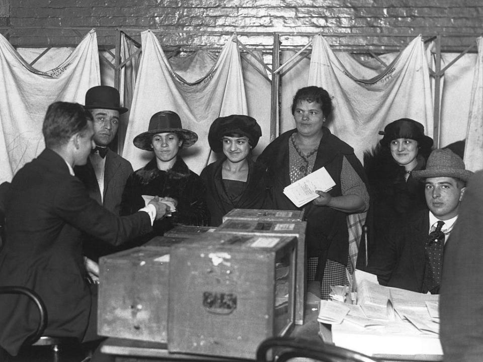 Women cast their first votes for president in 1920.