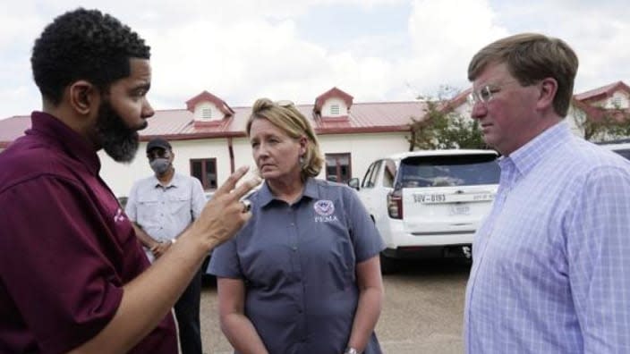 (From left) Jackson Mayor Chokwe Antar Lumumba, FEMA Administrator Deanne Criswell and Mississippi Gov. Tate Reeves confer after a September tour of Jackson’s O.B. Curtis Water Treatment Facility, where problems exacerbated water troubles. The year-end federal budget earmarks $600 million to help correct the situation. (Photo: Rogelio V. Solis/AP, Pool, File)