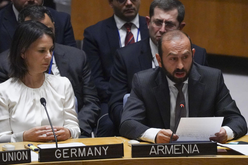 Germany's Foreign Minister Annalena Baerbock, left, listens as Armenia's Foreign Minister Ararat Mirzoyan address a United Nations Security Council meeting on the conflict between Armenia and Azerbaijan, Thursday Sept. 21, 2023 at U.N. headquarters. (AP Photo/Bebeto Matthews)