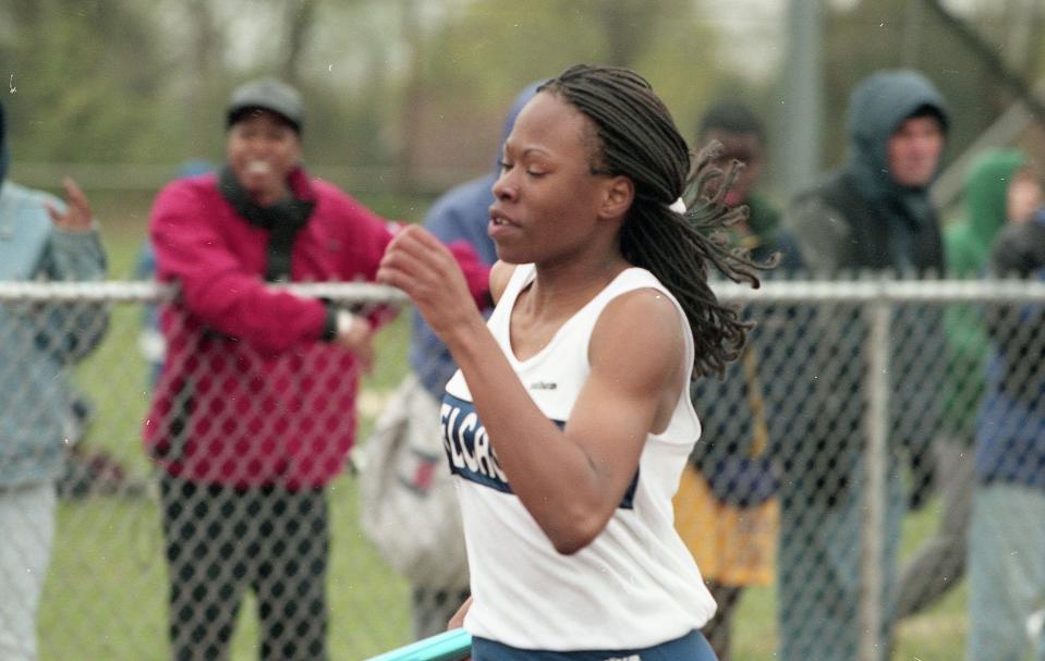 Delcastle's Rhondale Jones runs in a relay in 1998. Jones won 13 individual outdoor track and field state titles.