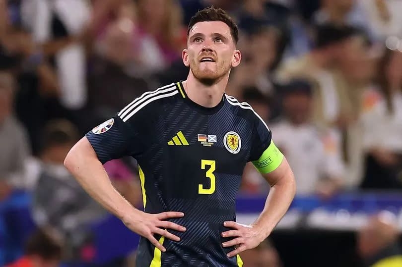 MUNICH, GERMANY - JUNE 14: Andy Robertson of Scotland reacts at full time during the UEFA EURO 2024 group stage match between Germany and Scotland at Munich Football Arena on June 14, 2024 in Munich, Germany.