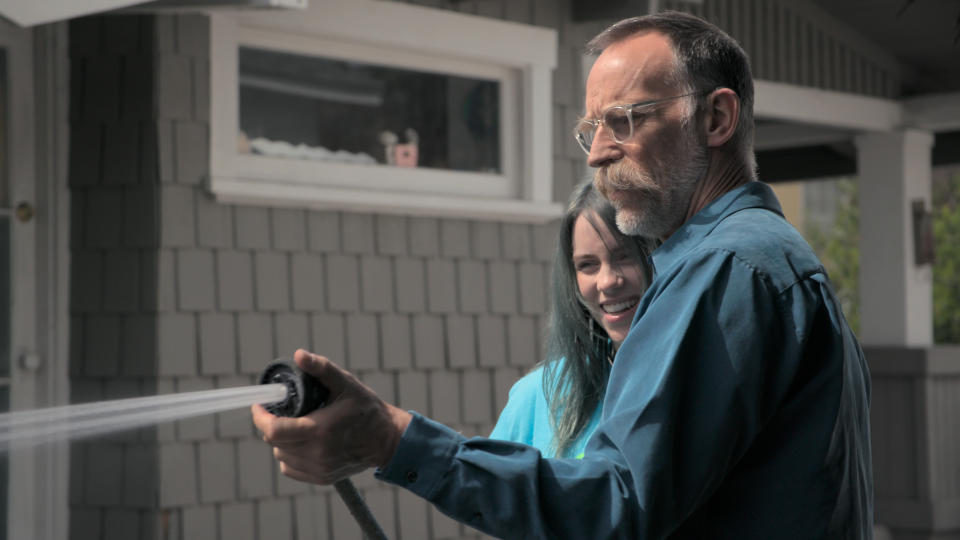 This image released by Apple TV+ shows Billie Eilish, left, and her father Patrick O’Connell in a scene from "Billie Eilish: The World’s A Little Blurry." (Apple TV+ via AP)