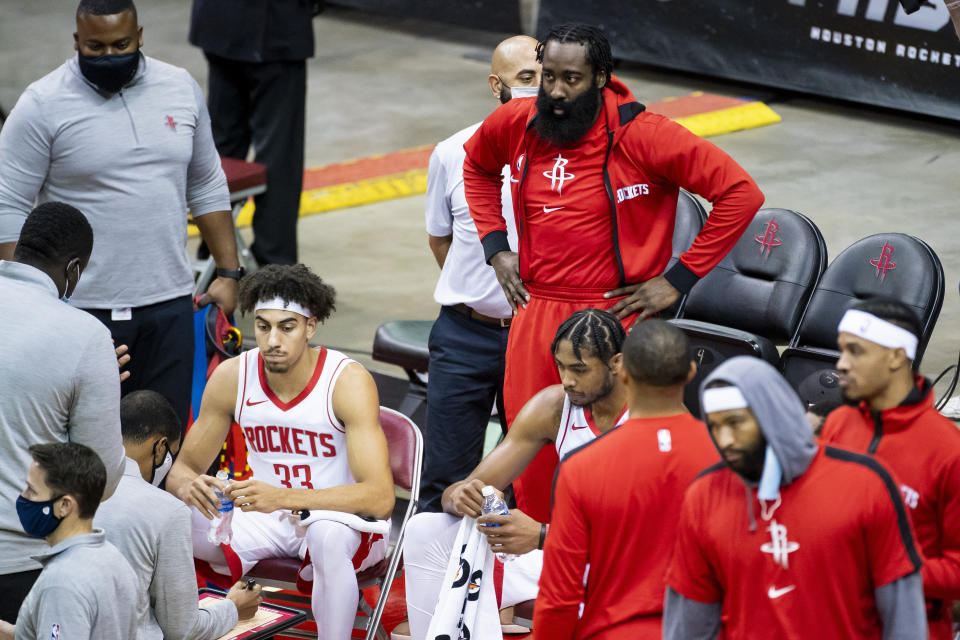 Houston Rockets guard James Harden, top center, joins the huddle during the fourth quarter of a preseason NBA basketball game against the San Antonio Spurs, Thursday, Dec. 17, 2020, in Houston. (Mark Mulligan/Houston Chronicle via AP)