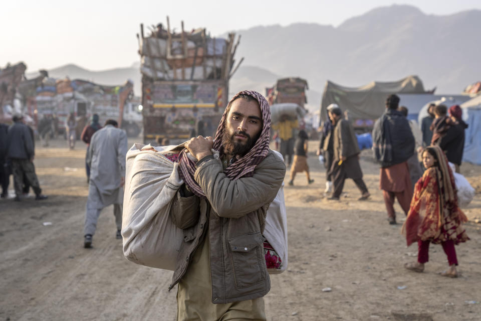 Afghan refugees settle in a camp near the Torkham Pakistan-Afghanistan border in Torkham, Afghanistan, Saturday, Nov. 4, 2023. A huge number of Afghans refugees entered the Torkham border to return home hours before the expiration of a Pakistani government deadline for those who are in the country illegally to leave or face deportation. (AP Photo/Ebrahim Noroozi)