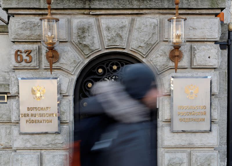 A man walks past the Russian embassy after Germany expelled two Russian diplomats in Berlin