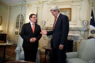 U.S. Secretary of State John Kerry (R) reaches out to shake hands with Cuba's Foreign Minister Bruno Eduardo Rodriguez Parilla (L) at the State Department in Washington July 20, 2015. REUTERS/Jonathan Ernst