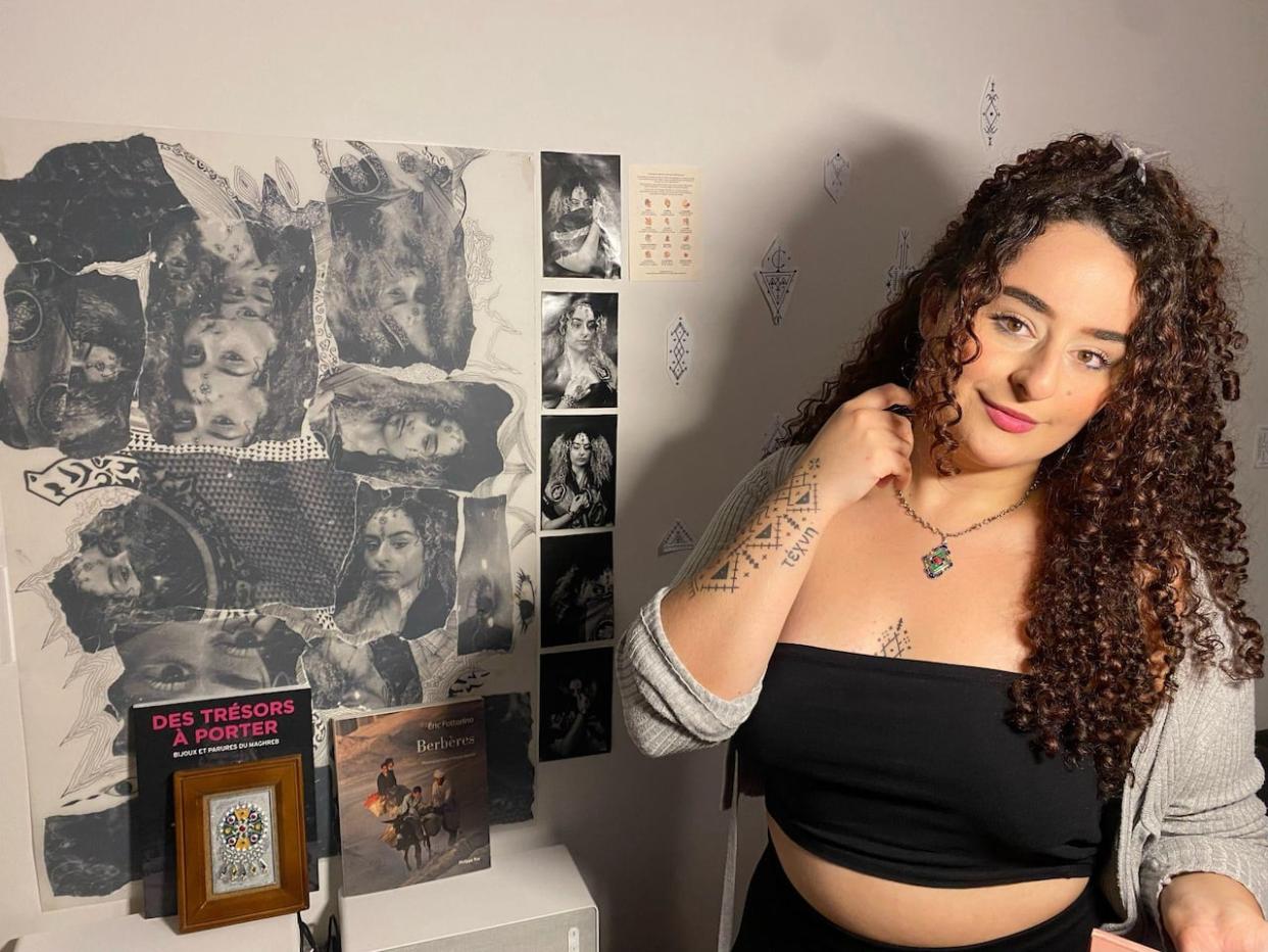 Tattoo artist Iness Aguin is completing her apprenticeship in Montreal, and tattoos clients using Amazigh symbols in her home studio in Laval, Que. (Fatima El Gahami - image credit)