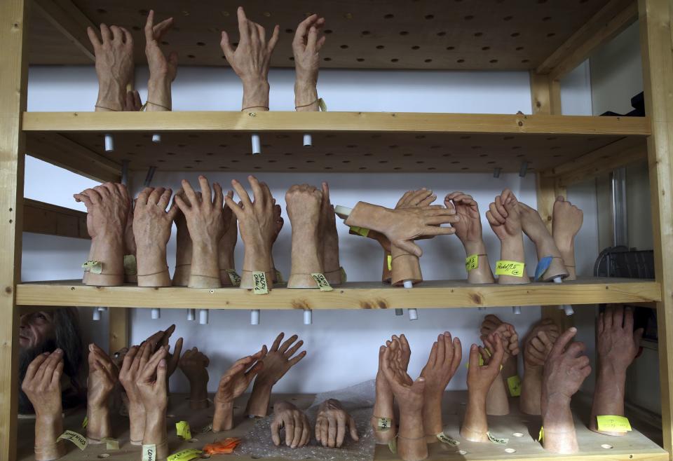 Hands wait for their bodies on a shelf at the Grevin Wax Museum workshop in Paris