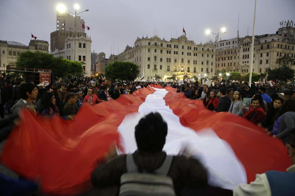 <p>Demonstrators protest against corruption at San Martin plaza, in Lima, Peru, Thursday, July 19, 2018. The latest scandal to embroil this South American nation has ensnared some of the country’s highest-ranking judges and political officials and comes just four months after then-President Pedro Pablo Kuczynski stepped down in a separate corruption probe. (AP Photo/Martin Mejia) </p>