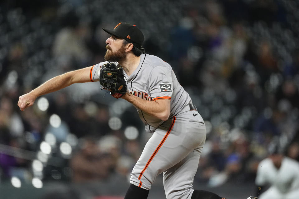 San Francisco Giants relief pitcher Ryan Walker works against the Colorado Rockies in the eighth inning of a baseball game Tuesday, May 7, 2024, in Denver. (AP Photo/David Zalubowski)