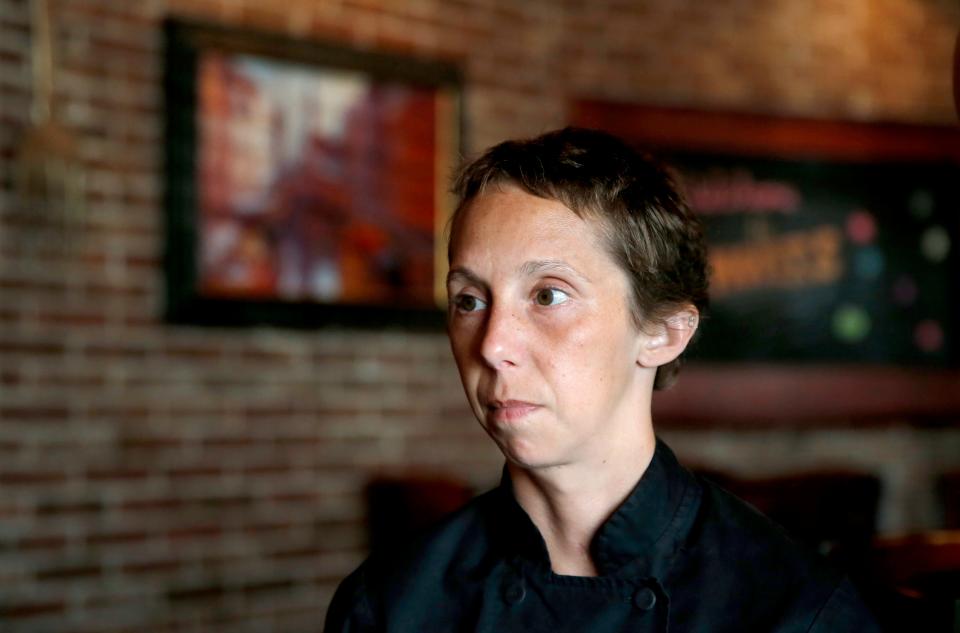 Chef Rachel Foster talks Thursday about her injuries at Moni's Pasta and Pizza.