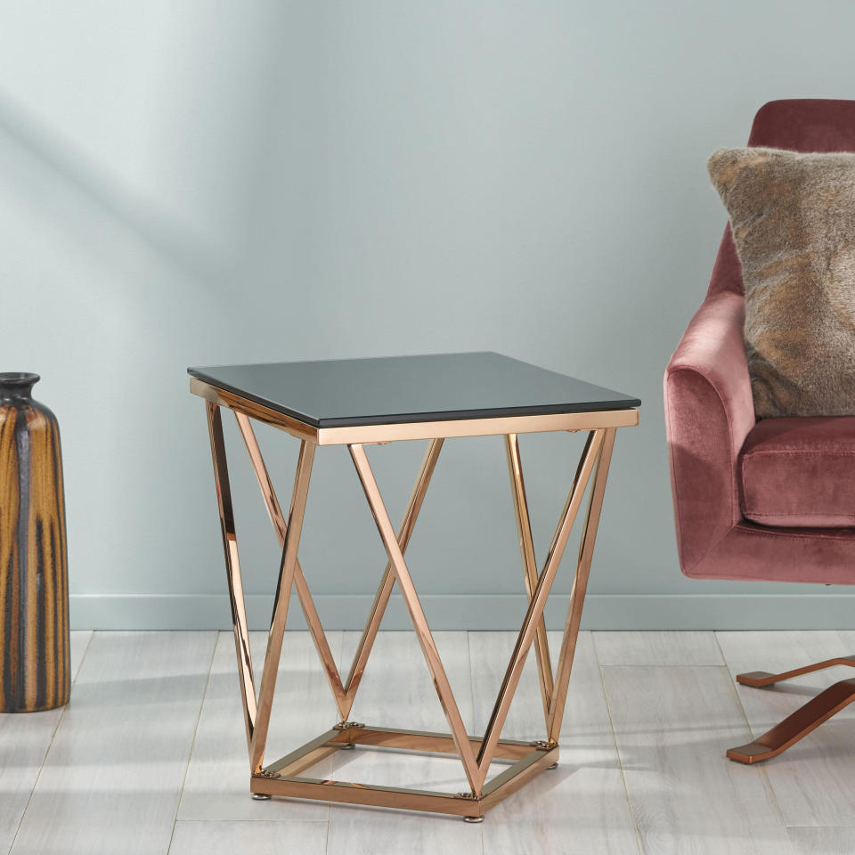 We can't help but fall for this black and rose gold side table, which will bring an elegant feel to your living room. You could also use it as a nightstand for your glasses and phone, too. <a href="https://fave.co/3iKFe3T" target="_blank" rel="noopener noreferrer">Originally $134, get it now for $78 at The Home Depot</a>.