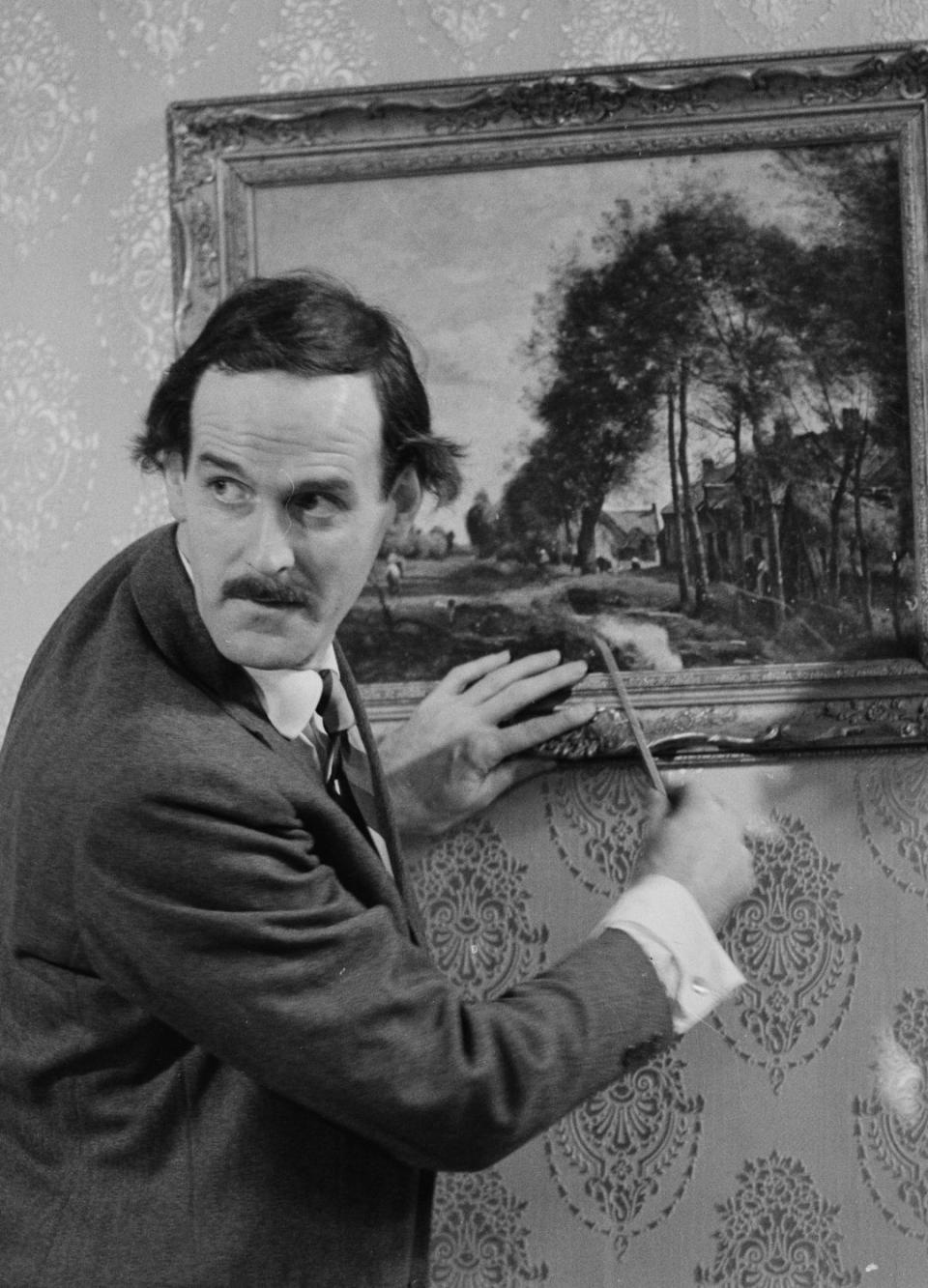 John Cleese as Basil Fawlty.