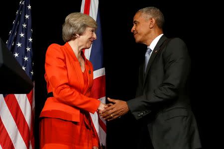 Britain's Prime Minister Theresa May (L) and U.S. President Barack Obama shake hands after speaking to reporters following their bilateral meeting alongside the G20 Summit, in Ming Yuan Hall at Westlake Statehouse in Hangzhou, China September 4, 2016. REUTERS/Jonathan Ernst