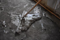 Mud scraped from the floor of a flooded house belonging to Lindi O'Brien is seen, June 17, 2022, in Fromberg, Mont. Local officials say about 100 homes and trailers got water when the Clarks Fork River hit record levels and jumped its banks the week before. (AP Photo/Matthew Brown)