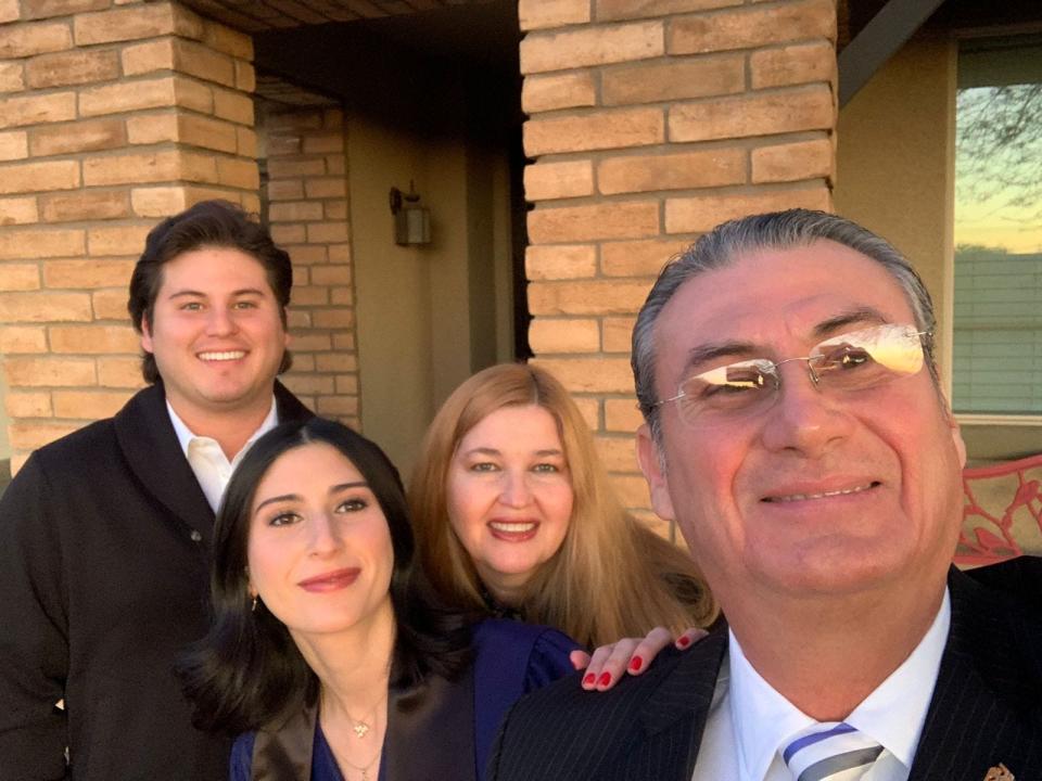 Mariano Gomez poses with his daughter, Cristina; son, Abelardo; and wife, Clarissa.