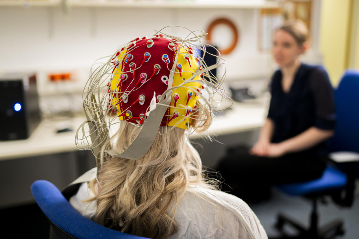 29 April 2024, Thuringia, Jena: A test subject wears an EEG cap with electrodes for EEG measurement. On July 6, 2024, electroencephalography (EEG), which was first tested on humans in Jena, will celebrate its 100th anniversary. The procedure measures the electrical activity of the brain and displays it graphically. Photo: Jacob Schröter/dpa (Photo by Jacob Schröter/picture alliance via Getty Images)