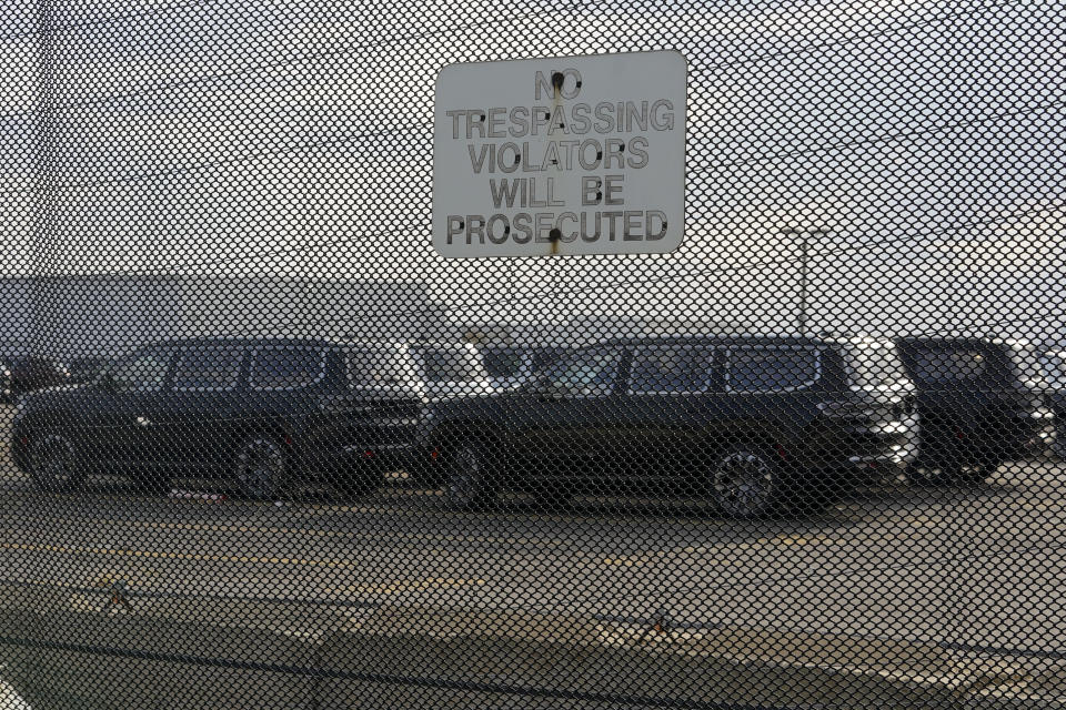 New vehicles are shown parked in storage lots near the the Stellantis Detroit Assembly Complex in Detroit, Wednesday, Oct. 5, 2022. Over the past few years, thieves have driven new vehicles from automaker storage lots and dealerships across the Detroit area. In 2018, eight vehicles were driven from what then was Fiat Chrysler's Jefferson North plant. (AP Photo/Paul Sancya)