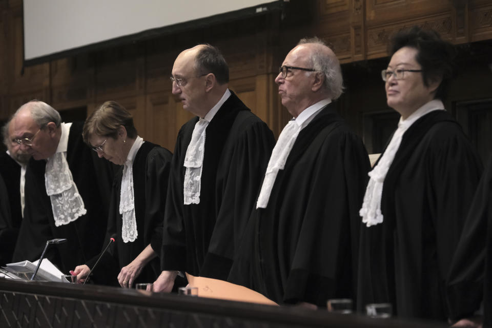 Judges start a hearing at the International Court of Justice in The Hague, Netherlands, Friday, Jan. 12, 2024. The United Nations' top court opened hearings Thursday into South Africa's allegation that Israel's war with Hamas amounts to genocide against Palestinians, a claim that Israel strongly denies. (AP Photo/Patrick Post)