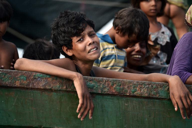 A Rohingya migrant crying as she sits with others in a boat drifting in Thai waters off the southern island of Koh Lipe in the Andaman