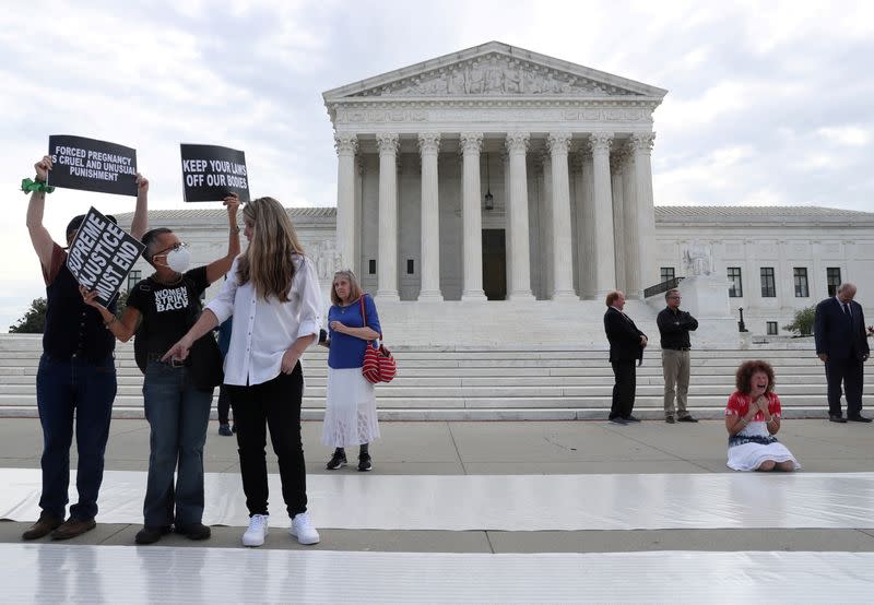 People protest against abortion rights outside of the U.S. Supreme Court building in Washington