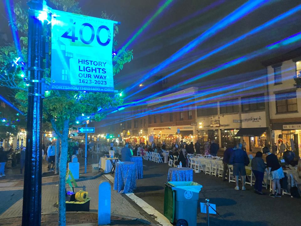 A laser show concluded the Wednesday, Aug. 16 2023 Portsmouth 400th anniversary dinner outside on Congress Street.