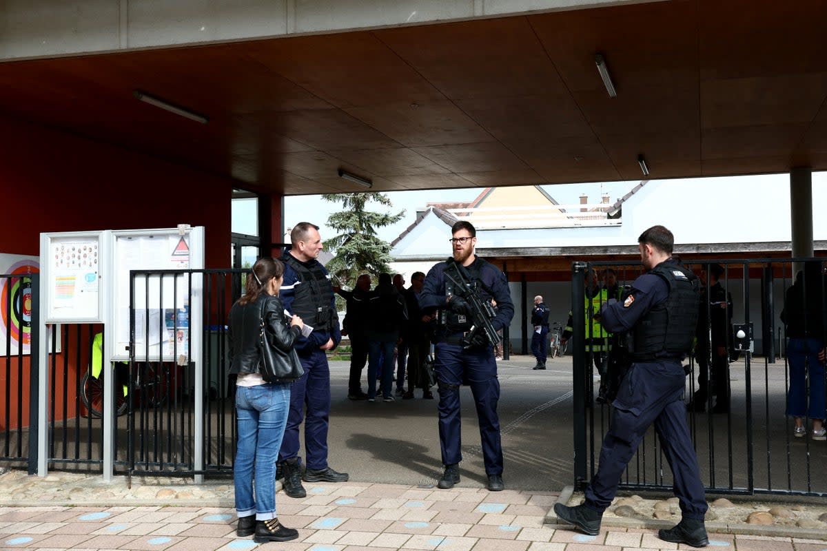 Gendarmes control the access to a school in the eastern France city of Souffelweyersheim while investigations are underway (AFP via Getty Images)