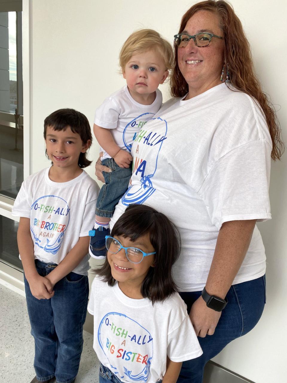 The Voigts Family, including mom Sarah, and siblings Konnor, 8, Kayliana, 6, and Kayde Reese, 16 months, celebrate National Adoption Day Friday, Nov. 3, 2023, by "O-fish-ally" welcoming Kayde into their family.