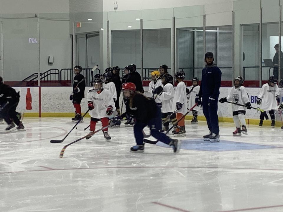 Anthony Duclair watches young hockey players during his camp last week in Coral Springs.