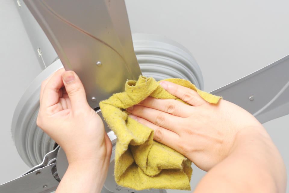 If you’ve ever wondered how to clean your ceiling fan without the dust flying off in every direction, look no further than this nifty hack. Photo: Getty Images